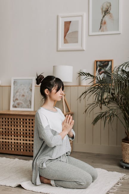 Woman practicing a gentle yoga pose at home in a cozy environment